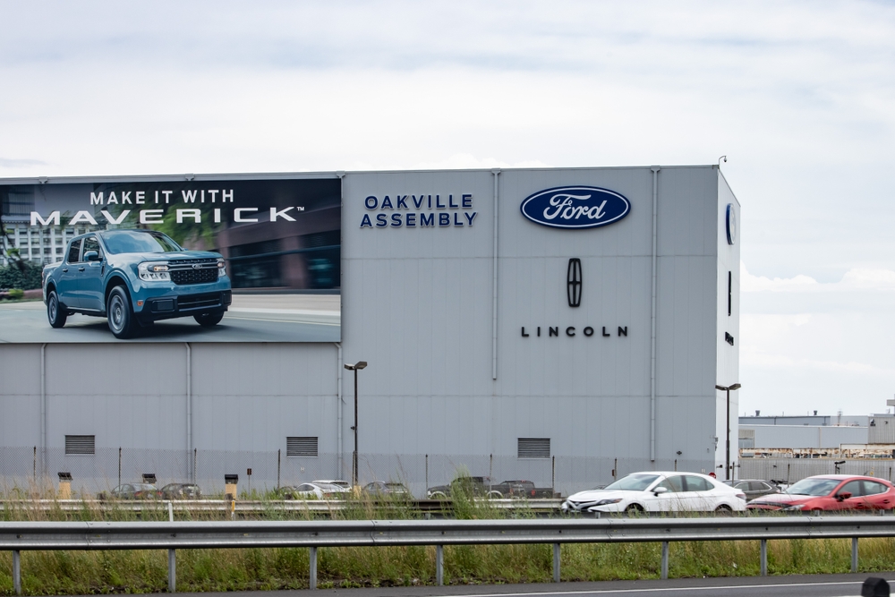 Oakville, Canada, July 28 2022; The Ford assembly plant building in Oakville featuring the Ford and Lincoln brand names and Maverick truck promotional signage