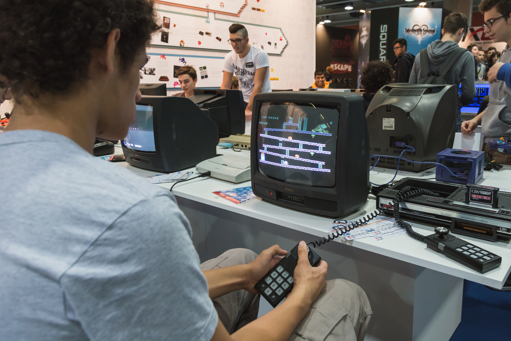 MILAN, ITALY - OCTOBER 24: Guy plays at Games Week 2014, event dedicated to video games and electronic entertainment on OCTOBER 24, 2014 in Milan.