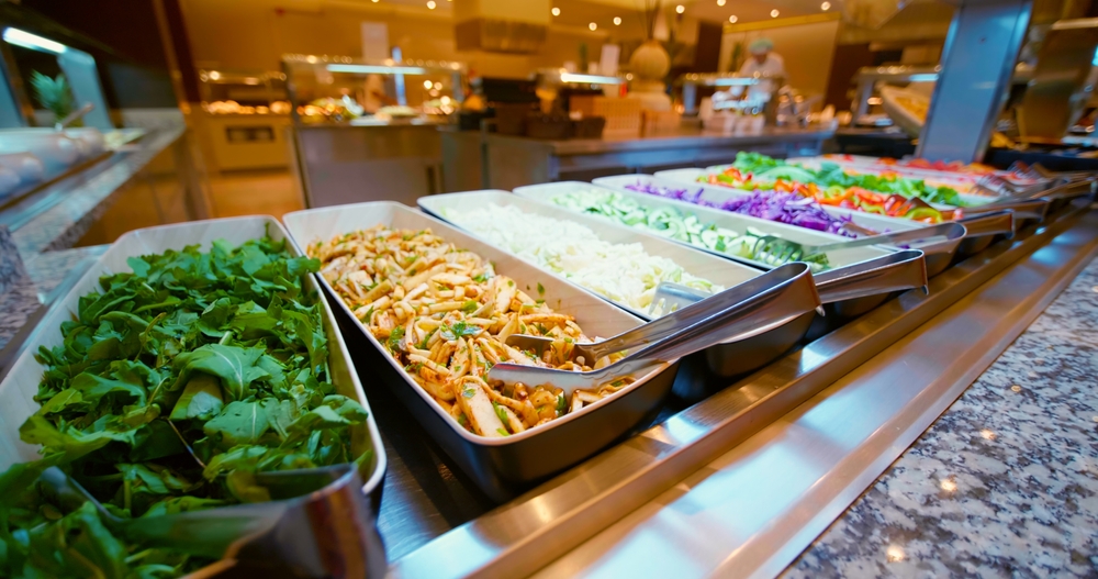 Salad, vegetables bar on self-service luxury hotel in Tunisia. All-you-can-eat buffet during lunch, dinner time. Choose dishes. Resort restaurant. All inclusive. Buffet food. Self-service restaurant.