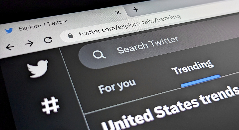 New York City, USA - 2023: Twitter website homepage with trending hashtags is displayed in a web browser on a computer screen