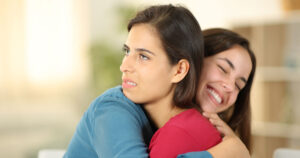 How to Spot a Fake Person by What They Say fake person hugging