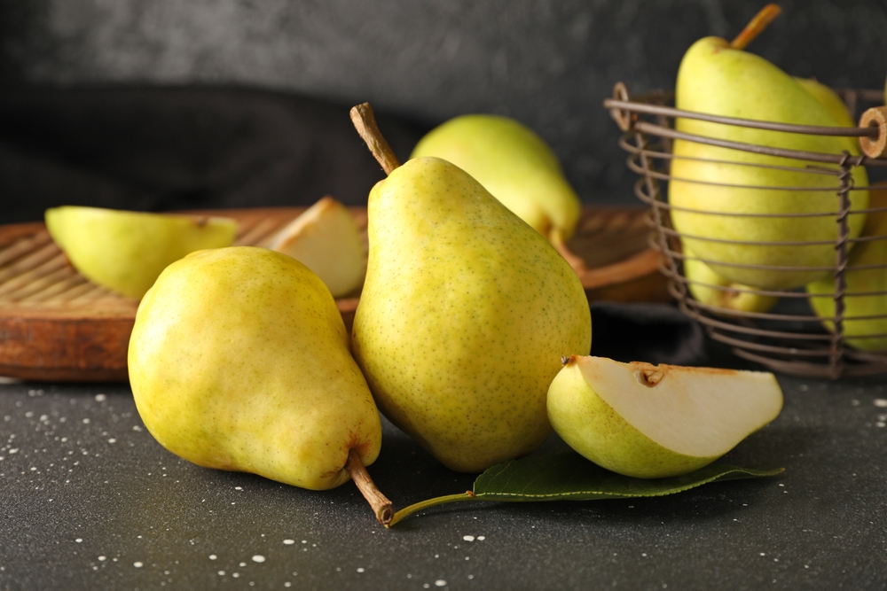 Ripe pears on black background