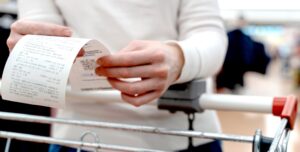 person holding a reciept