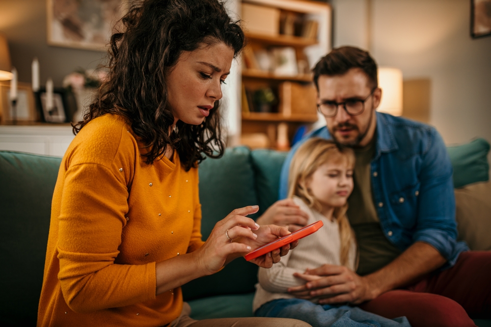 Anxious young Caucasian mom call ambulance doctor take care of sick small girl child having flu and high temperature. Worried family contact therapist