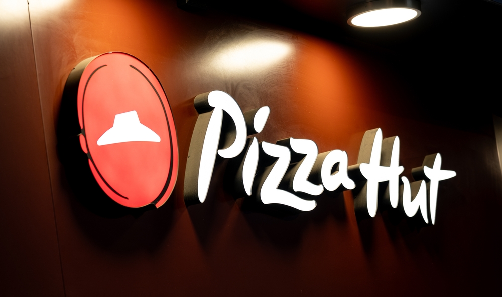 Warsaw, Poland - 29 December 2024: Large Sign With The Pizza Hut Logo At The Entrance Lighting At Night