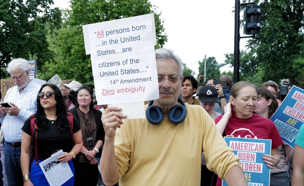 Washington, DC – May 15, 2025: Several hundred protesters rally at the Supreme Court against president Trump's illegal executive order to make birthright citizenship conditional.
