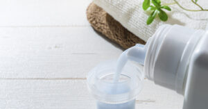 Fabric softener being poured into cap