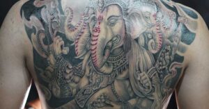 How Tattoos Impact the Immune System: What Science Is Just Starting to Reveal Intricate and large tattoo on man's back