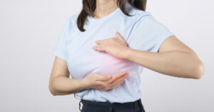 Don’t Wait: Early Breast Cancer Symptoms Everyone Should Recognize Breast cancer checking. Woman checking her breast on white background. How do I check breast concept. Breast cancer awareness