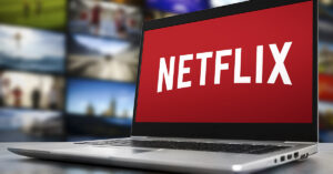 Ad-Free or Not? The Future of Paid Subscriptions Laptop open with Netflix logo displayed on the screen