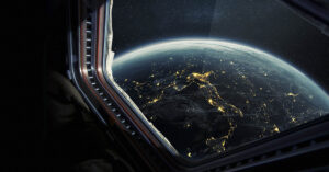 History Made: A Wheelchair User Has Journeyed Into Space a view of Earth from the window of a spaceship or space station, often associated with concepts of space travel or tourism
