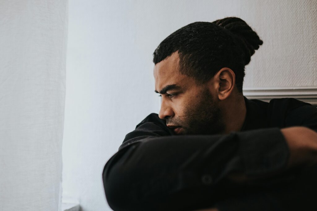 A Man Sitting and Looking Sad