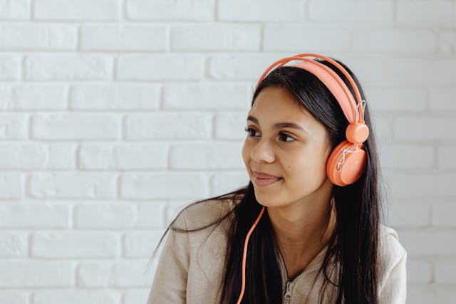 girl listening to music on headphones