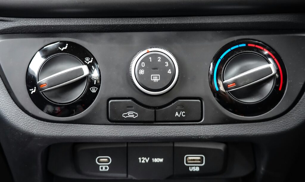 Close-up of Car Dashboard Controls with Air Conditioning
