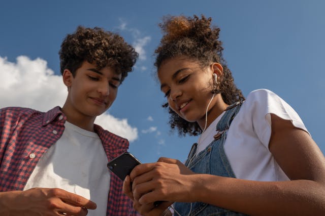 boy and girl listening to music