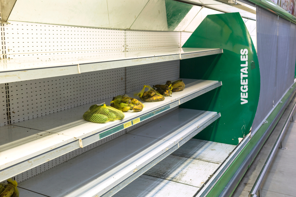 CARACAS, VENEZUELA - JANUARY 14, 2018: Empty supermarket shelves in Venezuela. Due to the economic crisis and hyperinflation in Venezuela there is a large shortage of food and medicine
