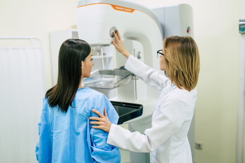 A young woman is examined for mammography in a hospital or private clinic by a specialist gynecologist.