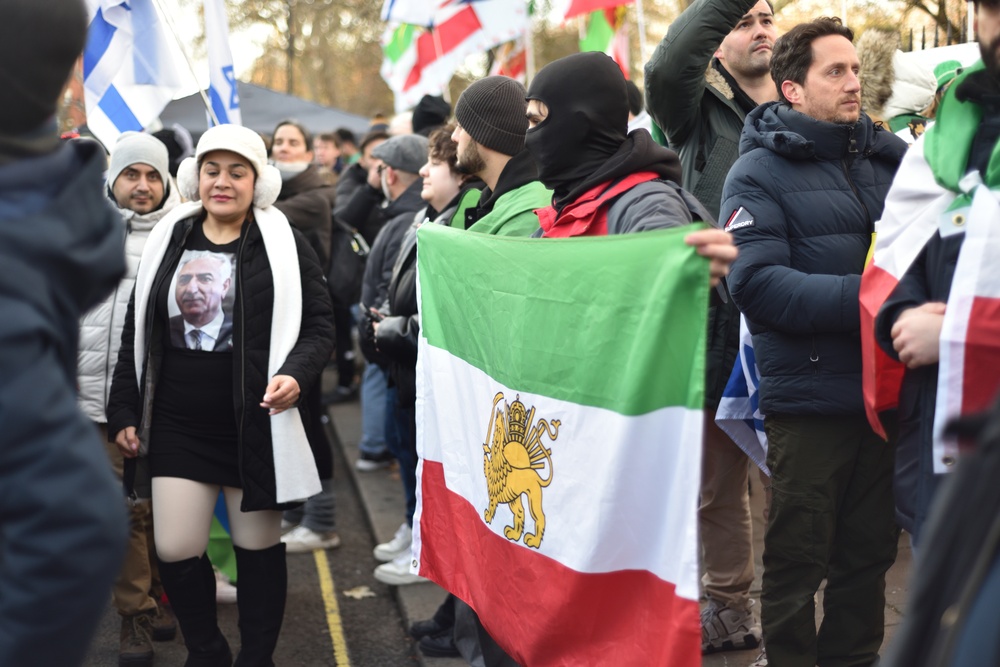 A protester wearing a balaclava holds up flag. Iranian Embassy Protest in London UK. Regime change in Iran.  3rd January 2026