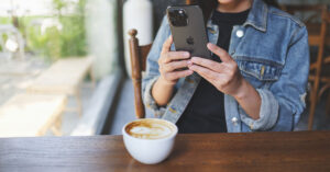 5+ Things Most iPhone Users Didn't Know Their Phone Could Do person taking a picture of their latte with an iPhone