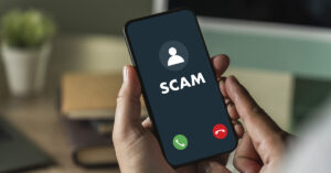 Scam Alert: 20+ Area Codes You Might Want to Ignore word "Scam" displayed on a smartphone