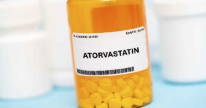 Cholesterol Drug Could Have Serious Side Effects in Some People, Health Authorities Say medication bottle labelled atorvastatin a cholesterol lowering stain drug