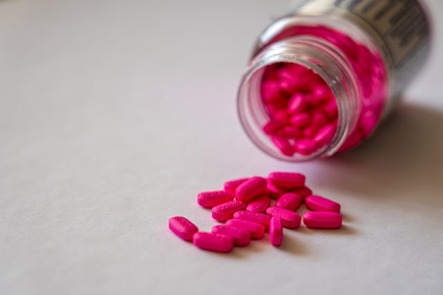 pink pills and bottle