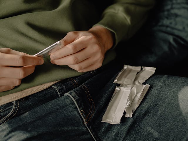 man with chewing gum wrappers