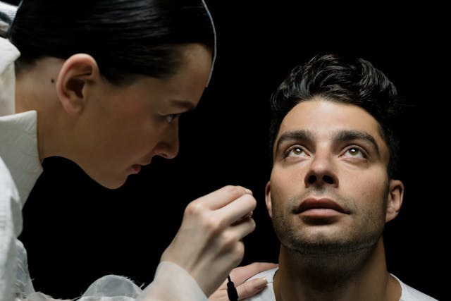 doctor looking at man's ear
