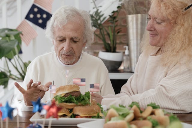Senior eating a burger