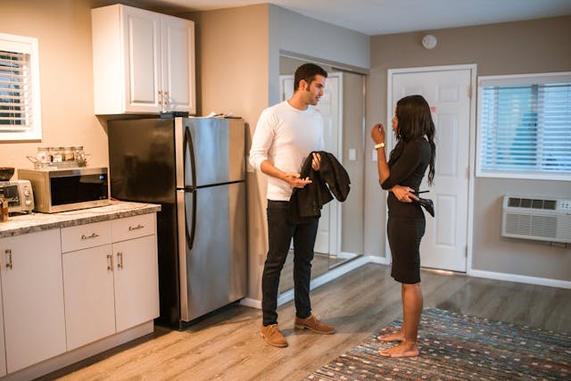 Couple talking in kitchen