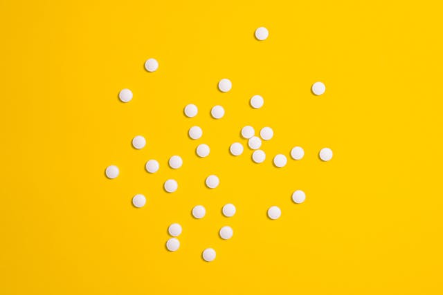 pills on a yellow background