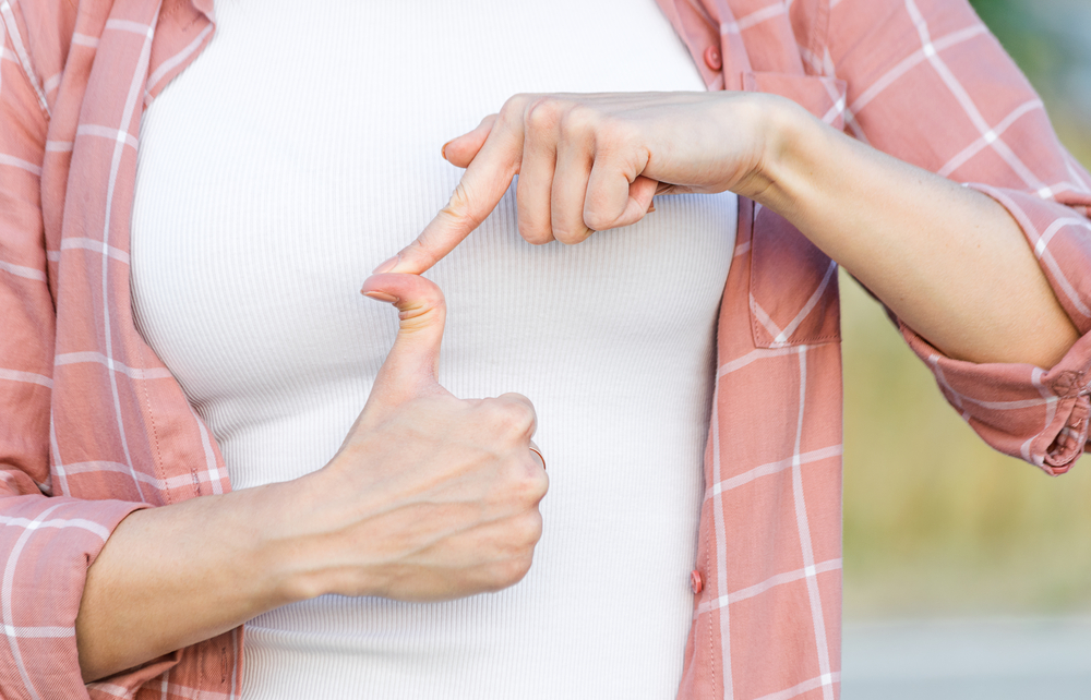 woman showing thumb up. hand with hyper flexible thumbs