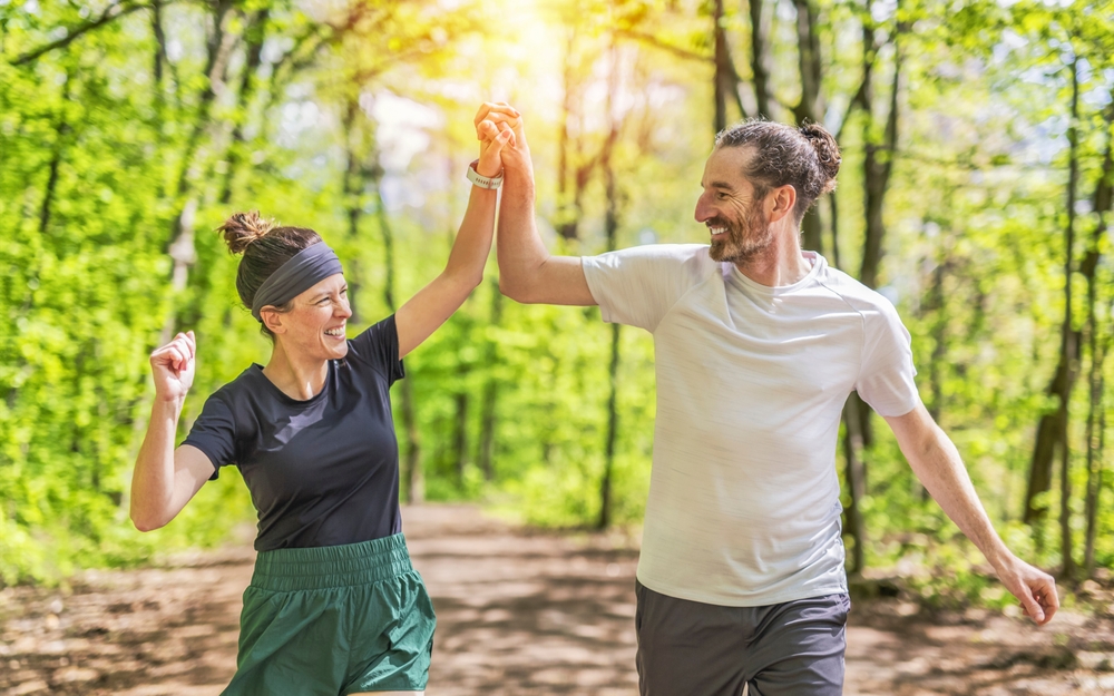 A Couple jogging and running outdoors in nature