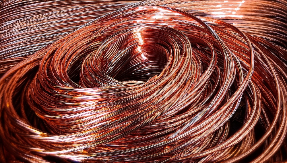 Detail of copper, a scrap material swirl close-up with textured surface. Expensive resource metal ready to be recycled and used in the industry. Circular economy concept
