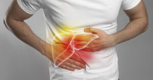 person experiencing symptoms commonly associated with liver disease