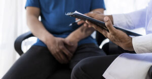 Bladder Cancer Can Be Silent at First: 5 Early Warning Signs to Know a male patient consulting a doctor regarding bladder issues