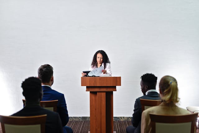 woman talking at podium 