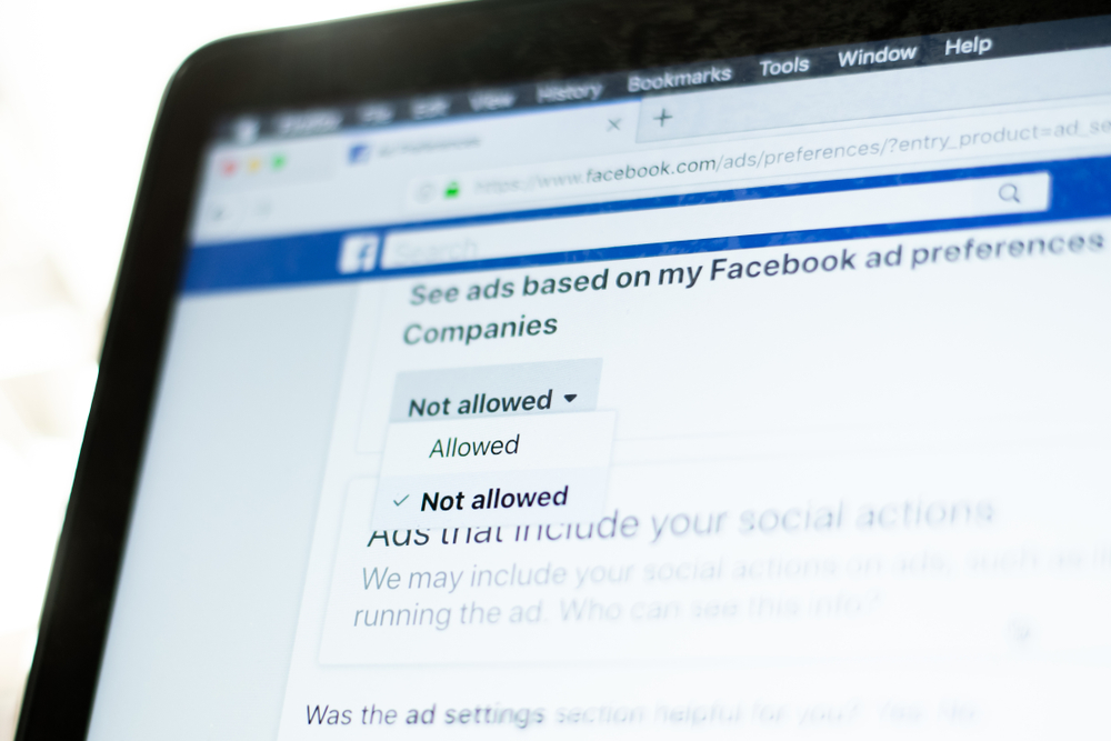 Milan, Italy - January 2, 2019: User moves and hovers the mouse pointer over the "Not allowed" selection of the Facebook ads settings on a Facebook page.