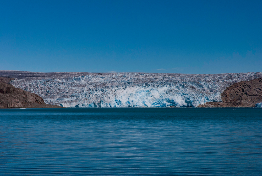 Melting iceberg into fjord water. Greenland