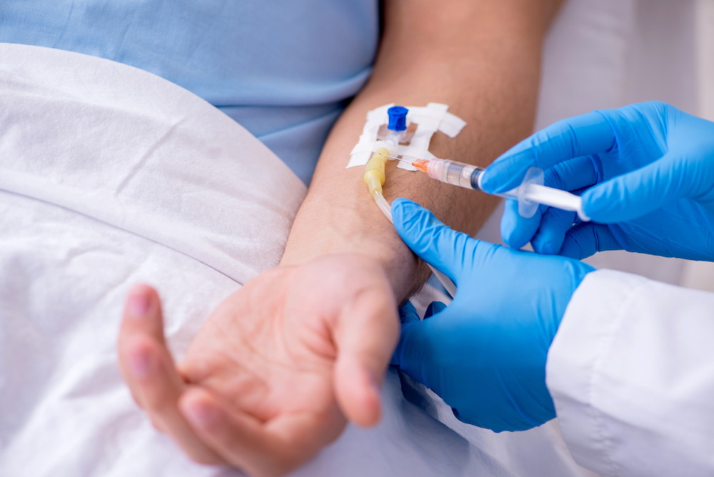 Male patient in blood transfusion concept