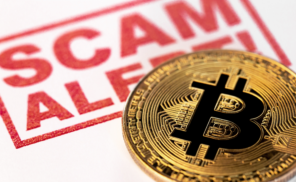 cyber security, scam with Bitcoin cryptocurrency symbol on white background closeup
