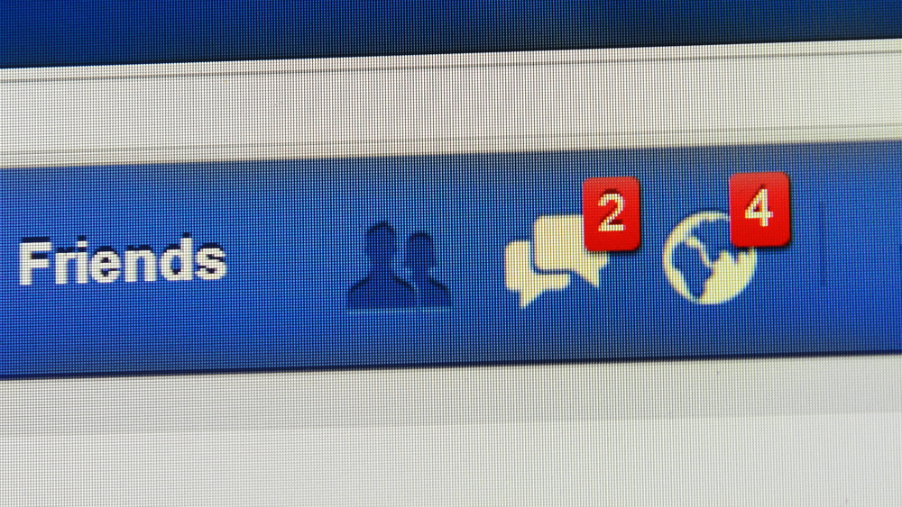 LONDON - AUG 19: Close-up view of Facebook notifications tabs on Aug 19, 2014 in London, UK. Facebook is the world's largest online social network services with reportedly 1.28 billion active users.