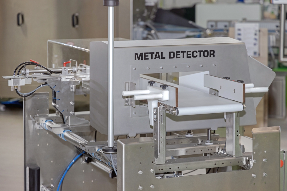 Metal Detector Machine at Conveyor Belt Food Production Factory Safety