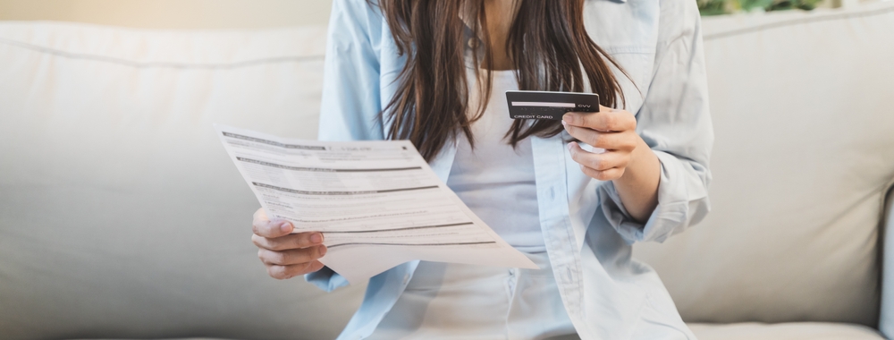 Financial household debt concept, stressed young asian woman trying to find money to pay credit card debt.