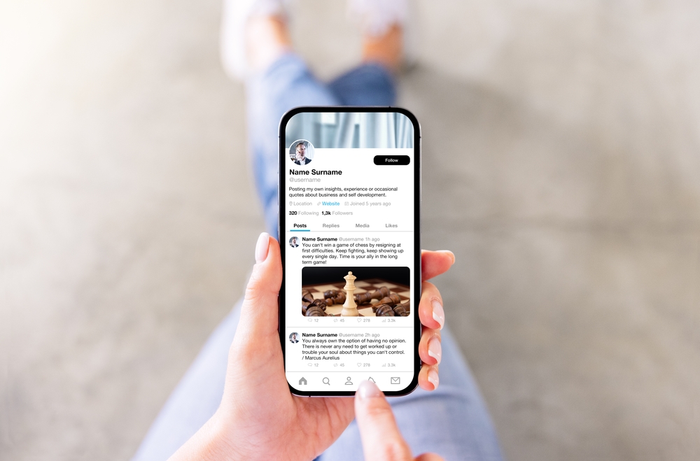 Woman viewing someone's profile page on sample social media app