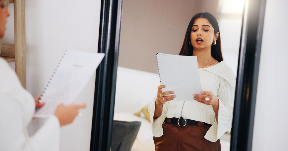 Practice, speech and woman in mirror in home for public speaking, presentation and monologue. Talking, reflection and person with paperwork, documents and reading for oral, proposal and lecture