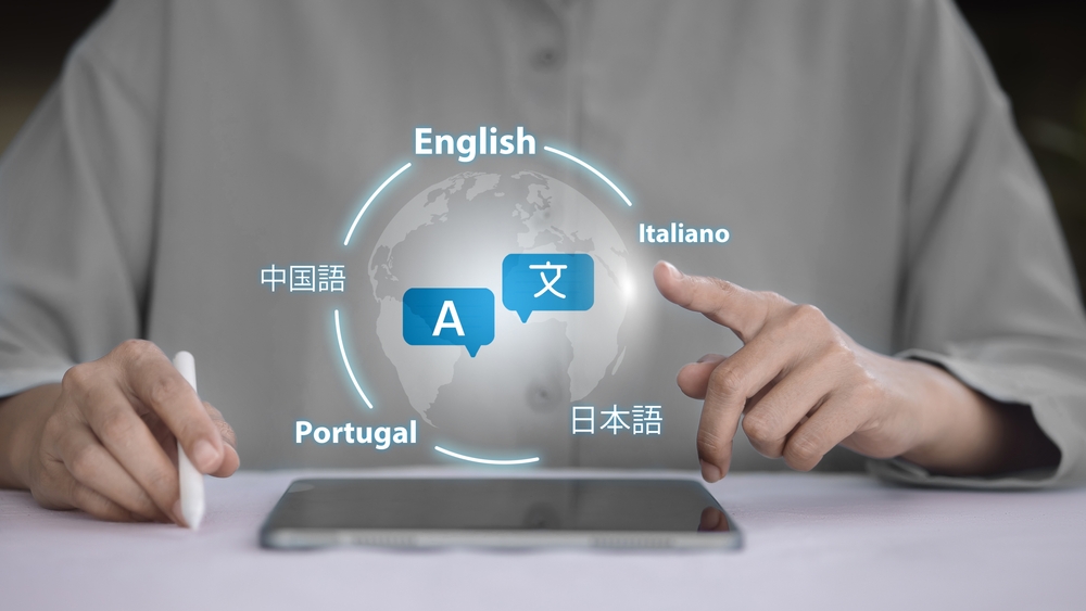Person interacting with global language selection interface on tablet. Concept of real-time translation, globalization, and language tech.