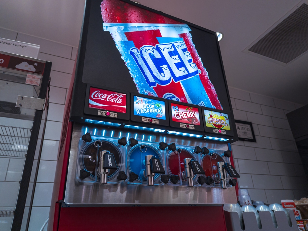 Apex, North Carolina  - August 20 2025: A Brightly Lit Icee Coca Cola And Blue Raspberry Slushie Machine At Target