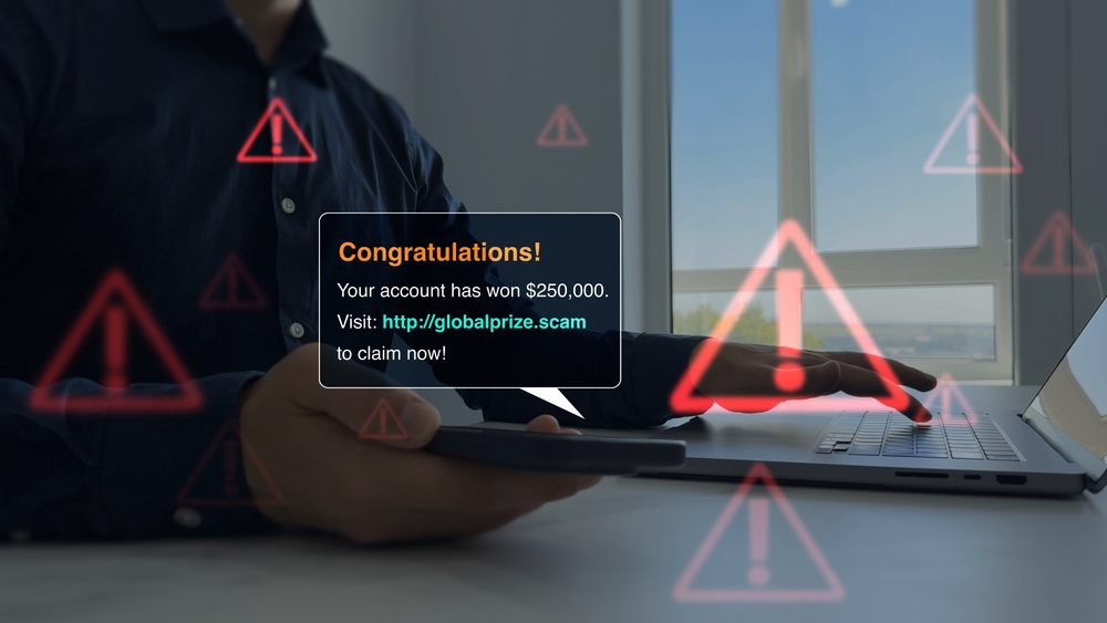 Bank fraud through phone messages.Businessman holding phone with scam message on digital screen. Fake text SMS scam.Scammers online.Cyber scam.