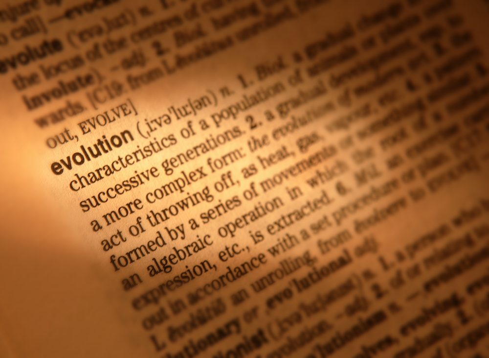 CLOSE UP OF DICTIONARY PAGE SHOWING DEFINITION OF THE WORD EVOLUTION, TAKEN IN CLECKHEATON, WEST YORKSHIRE, UK, 17TH JUNE 2004